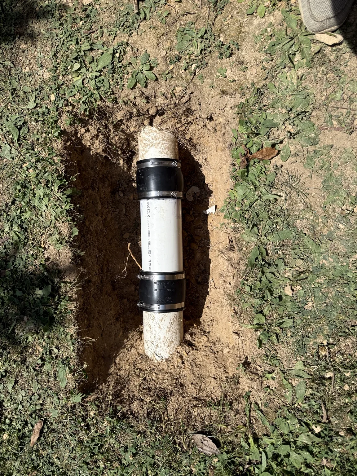 Repaired underground PVC drain line